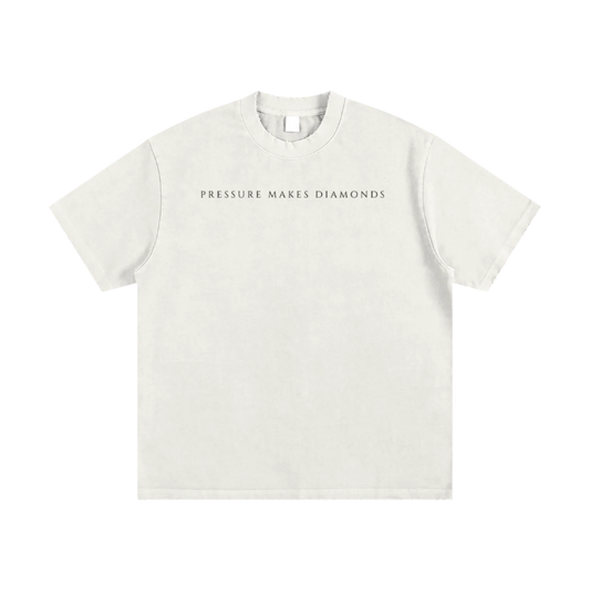 White t-shirt with 'PRESSURE MAKES DIAMONDS' text on a white background