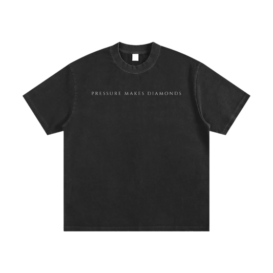 Black t-shirt with 'PRESSURE MAKES DIAMONDS' text on a white background